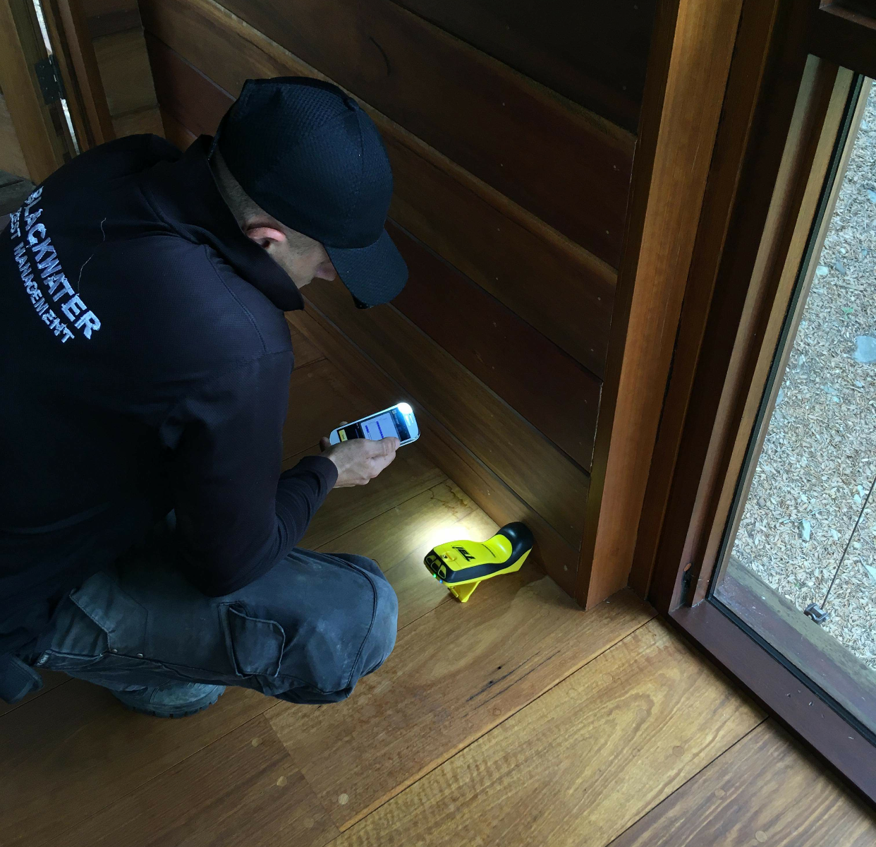 Man inspecting a property with the termatrac state of the art termite detection machine
